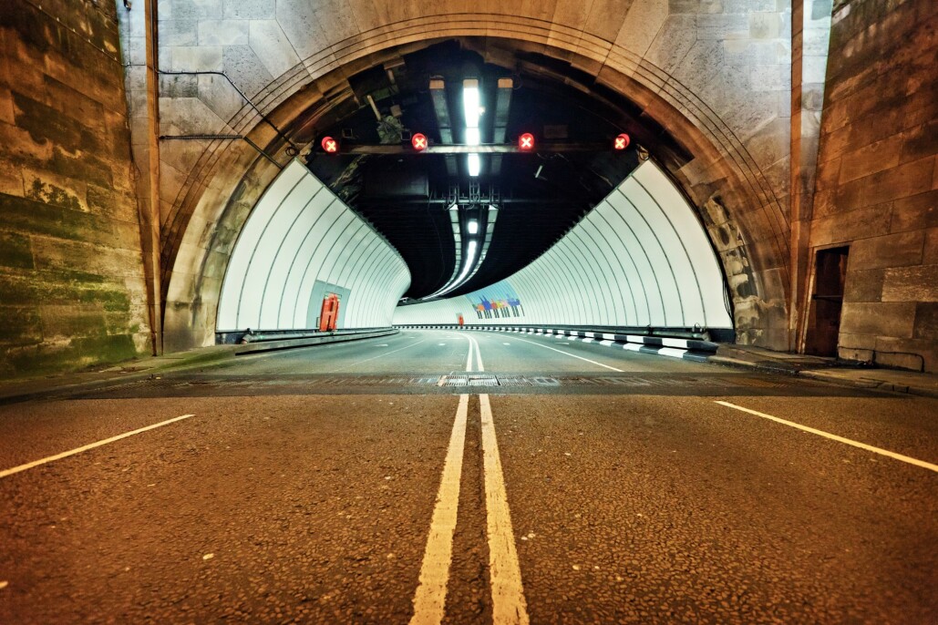 The entrance to the Queensway tunnel lit up at night