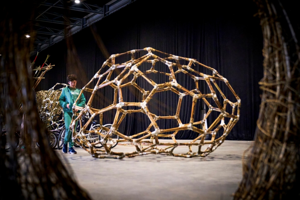 A bamboo sculpture made up of lots of hexagons of bamboo giving the effect of a large honeycomb made of bamboo. It's what bamboo looks like under the microscope.