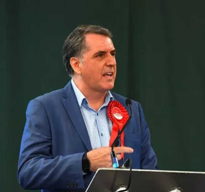 Mayor of the Liverpool City Region Steve Rotheram wearing red Labour rosette