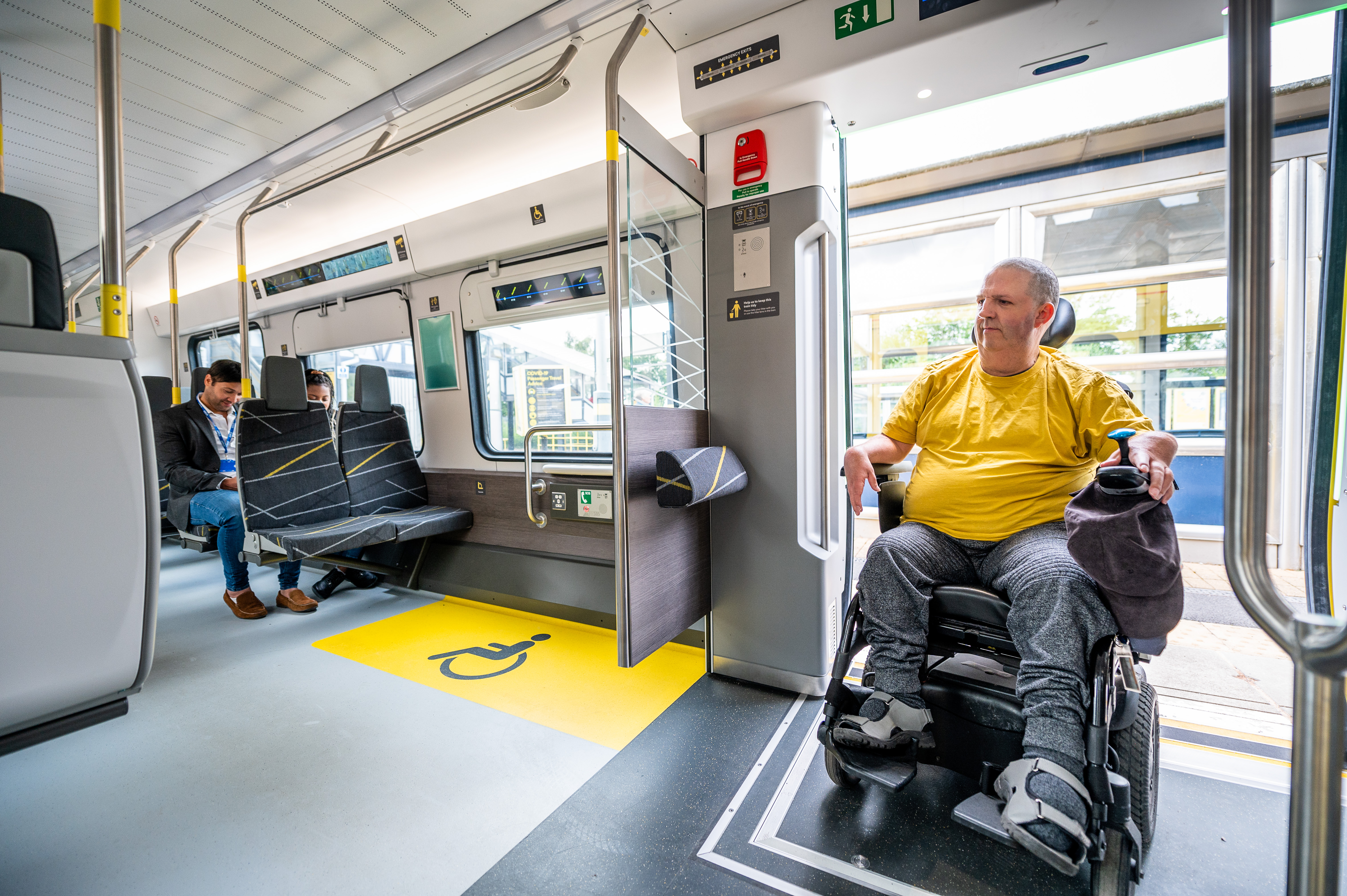 Person in a wheelchair boarding a new Class 777 train