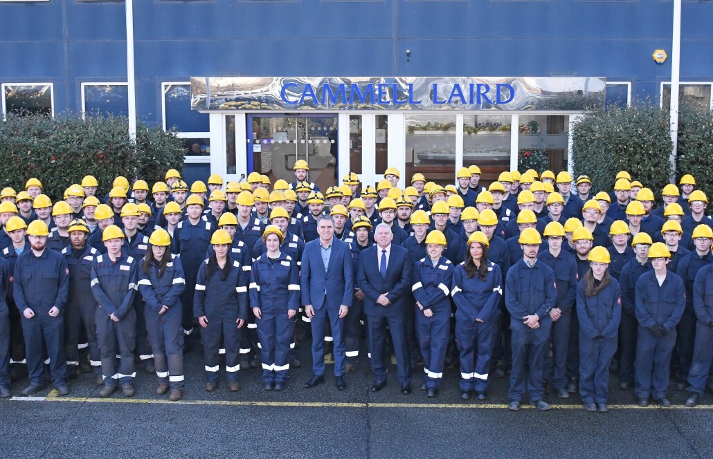 Mayor Steve Rotheram stands amid apprentices in front of the Cammell Laird shipbuilders