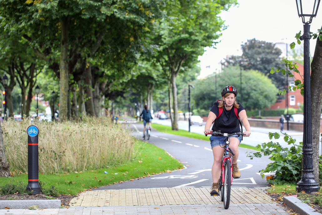 woman riding her bike along a cycling path