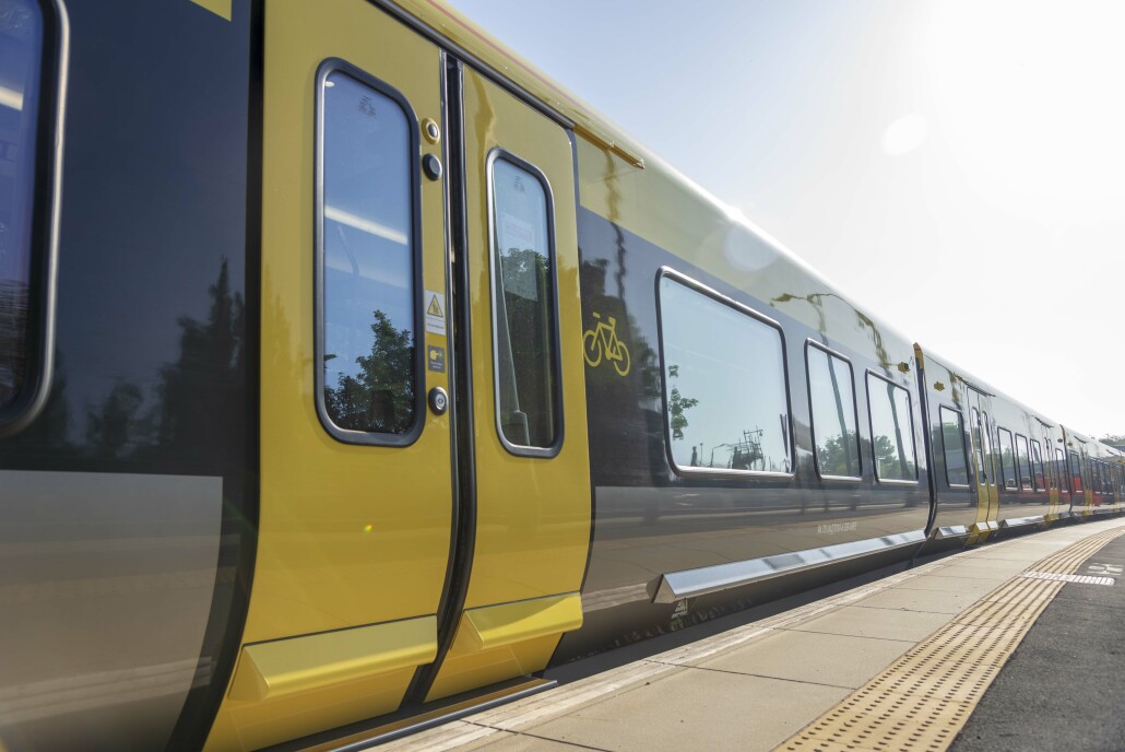Picture shows one of the new Merseyrail trains at the platform of a station.