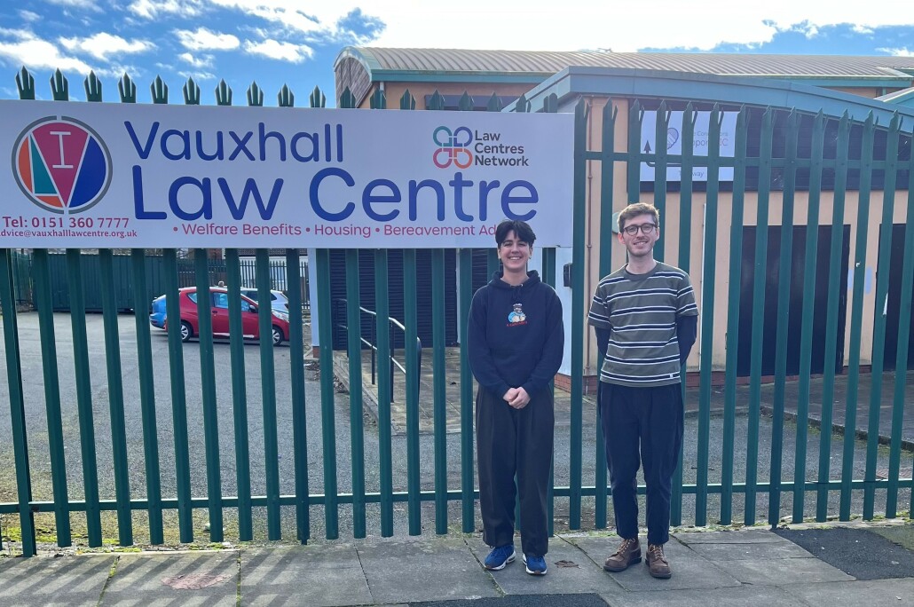 Two apprentices stand outside a law centre in Liverpool