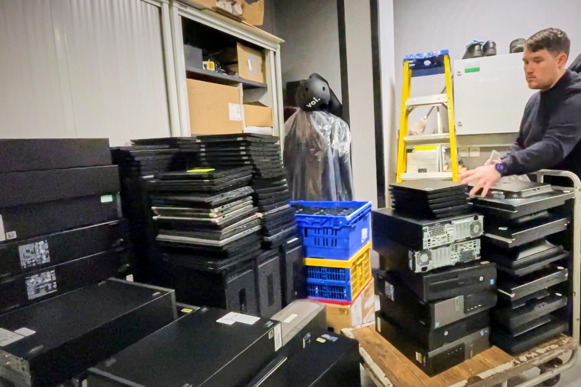 Hundreds of devices, including laptops and computers, piled up.