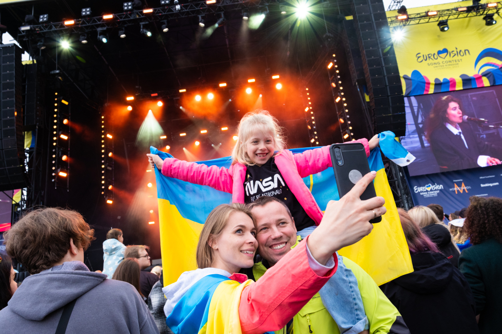 A family at Eurovision Village in 2023