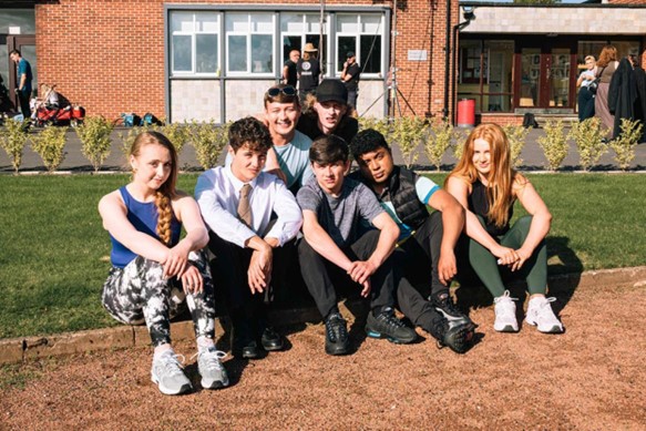 Some of the cast of G’wed sitting together on set (Picture: ITV)