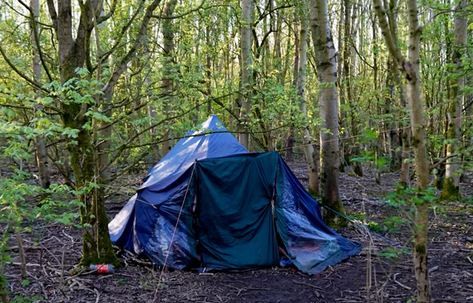 A homeless person's tent in the woods