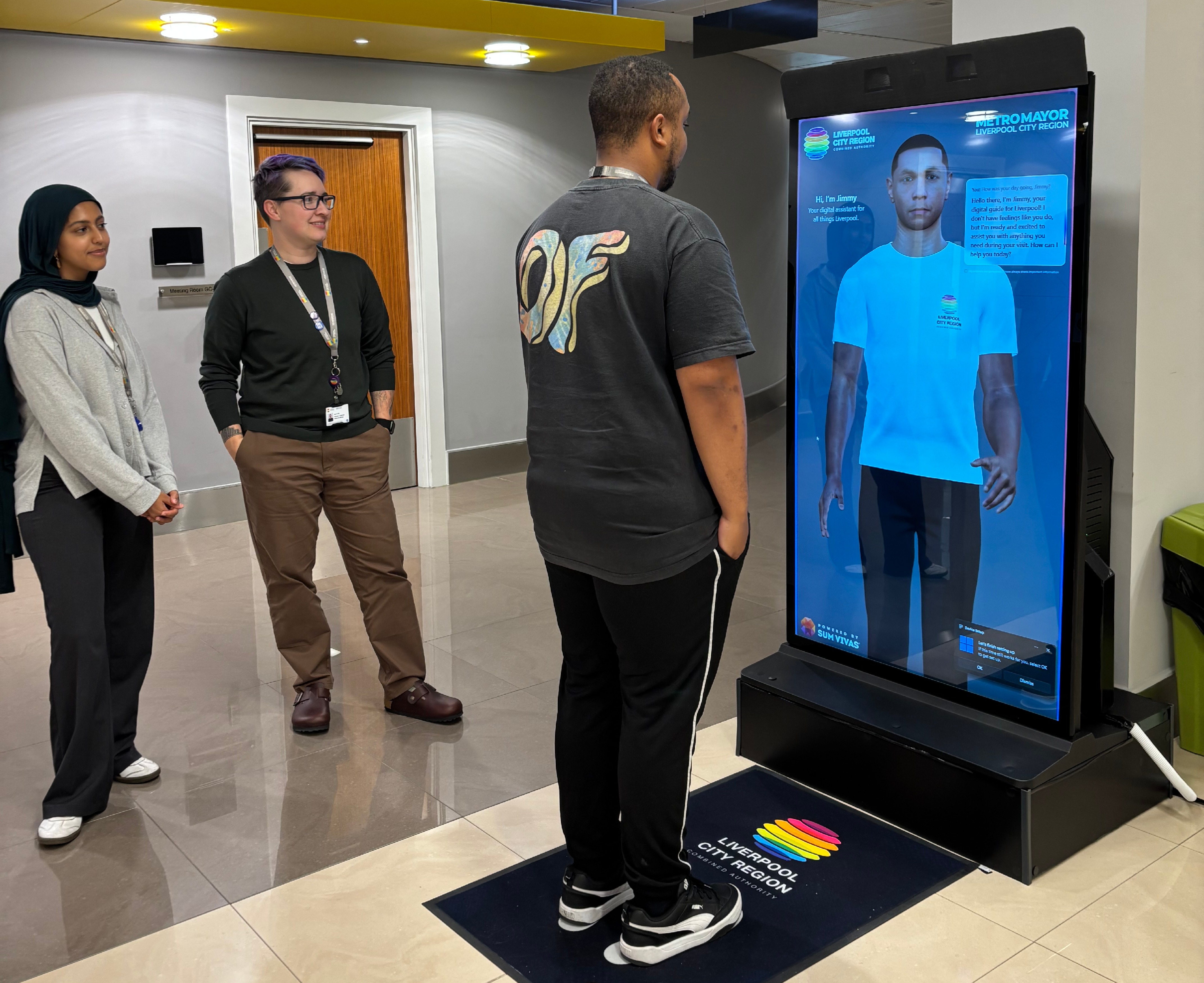People testing out AI assistant Jimmy, who will be guiding passengers across the Liverpool City Region transport network.