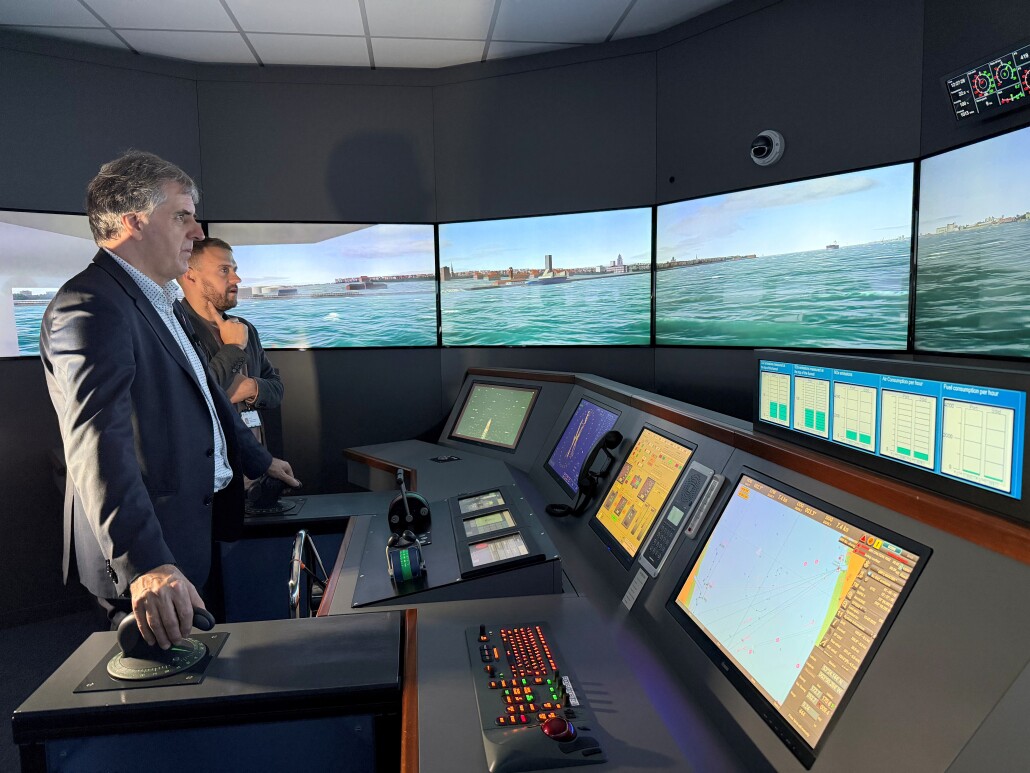 Mayor Rotheram at the controls of a simulator of the new Mersey Ferry at Liverpool John Moores University
