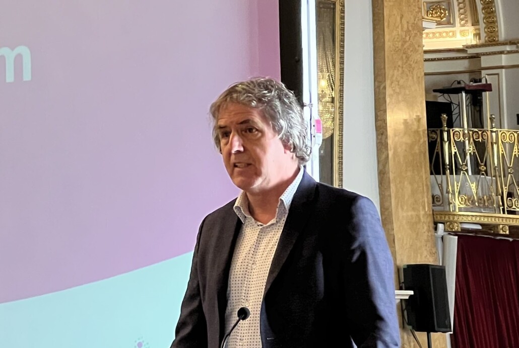 Mayor Steve Rotheram speaking at a lectern
