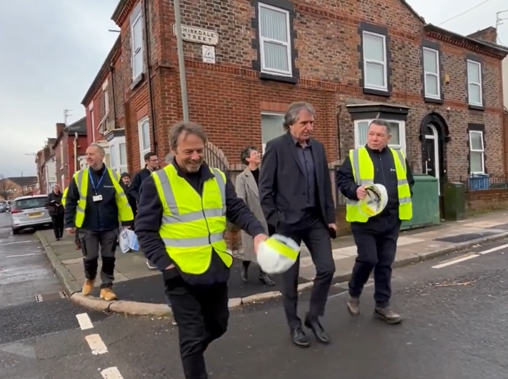Mayor Steve Rotheram walks with Retrofit workers along the street in Kirkdale