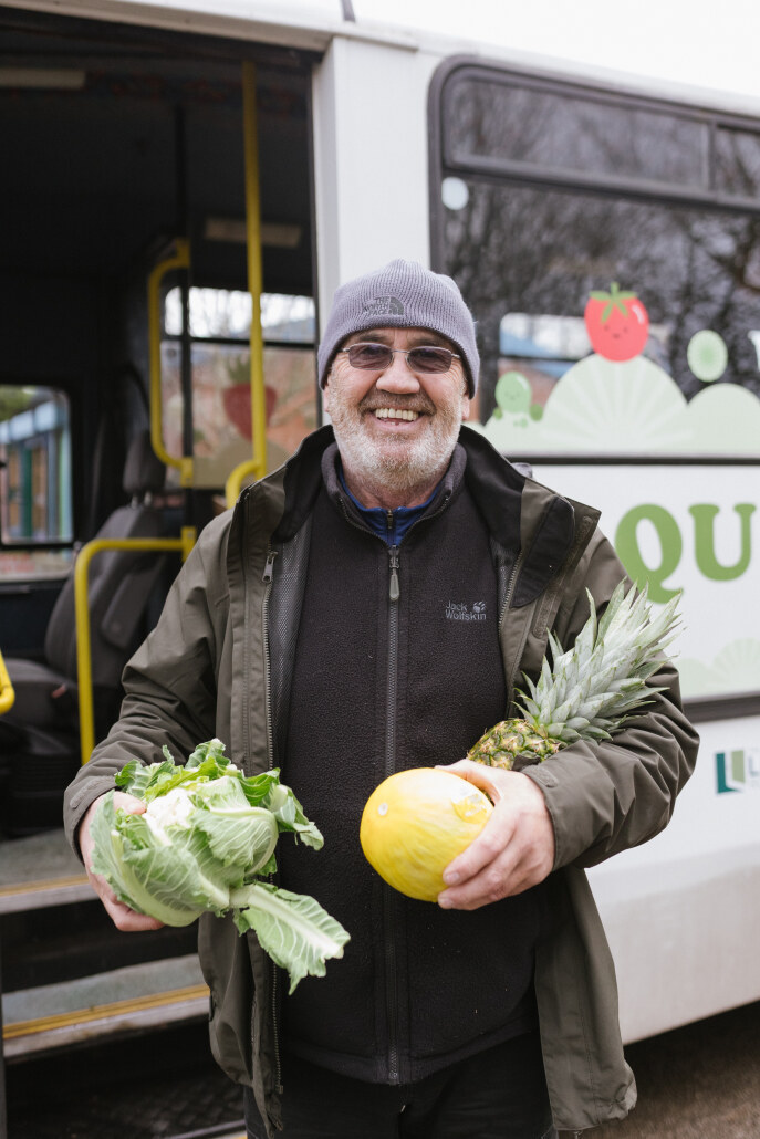 Pic: Paul Flannery, of social enterprise Queen of Greens, pictured in front of mobile greengrocer bus.