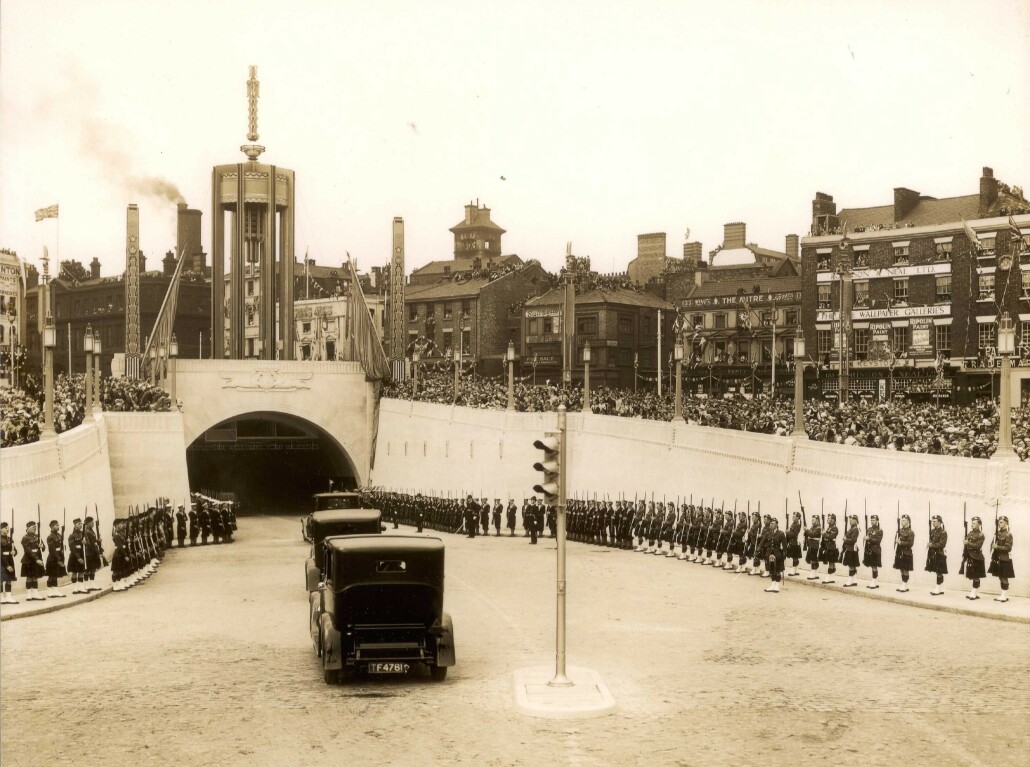 Opening Day in 1934 showing the first cars driving into the Queensway Tunnel.