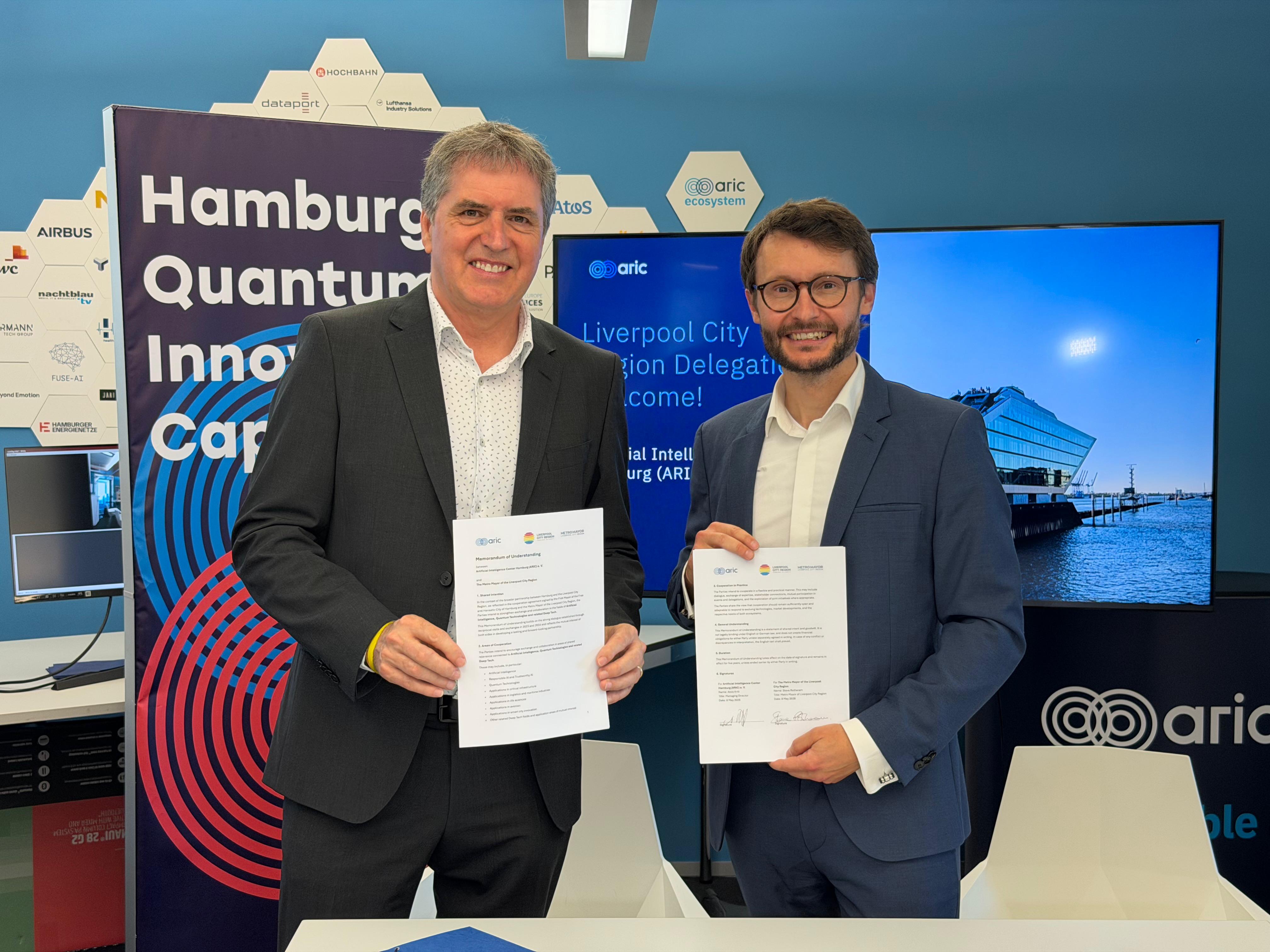 Liverpool City Region Mayor Steve Rotheram and ARIC CEO Alois Krtil at the signing of an MOU in Hamburg to develop a trans-European AI supercluster