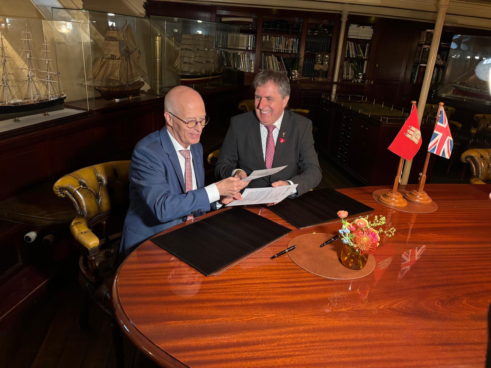 Liverpool City Region Mayor Steve Rotheram and Hamburg's First Mayor Dr. Peter Tschentscher signing a Joint Declaration of Intent aboard Hamburg’s civic ship - the Rickmer Rickmers - to strengthen academic, cultural and economic ties.