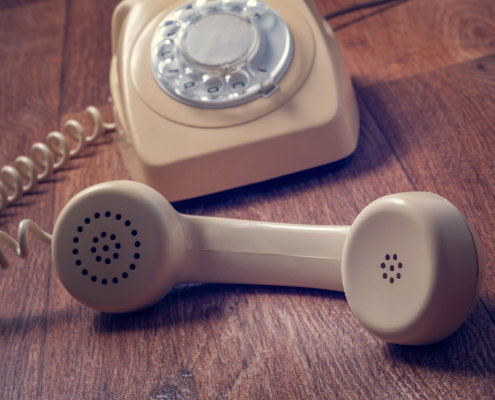 An old-style landline that's off the hook.